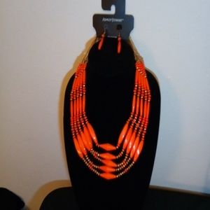 Orange beaded necklace with earrings.